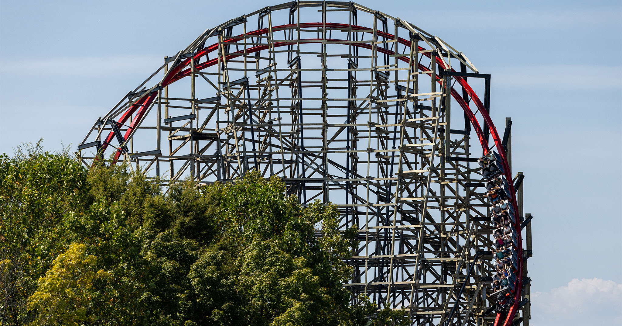 A steep banked turn of the roller coaster Wildcat's Revenge. The track is bright red.