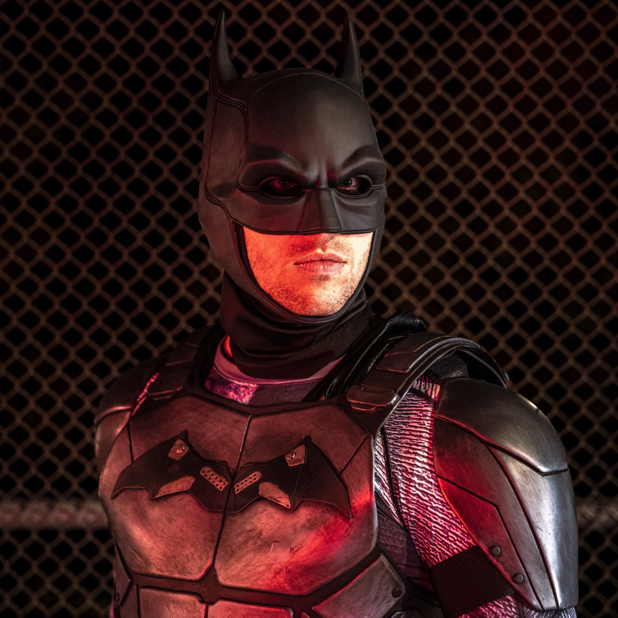 A cosplayer playing Batman.